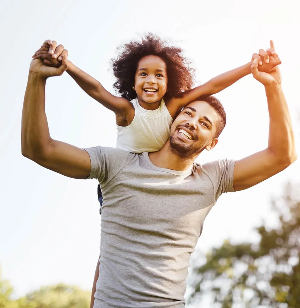 Father and daughter smiling